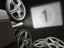projector pointed at a screen displaying the number 1